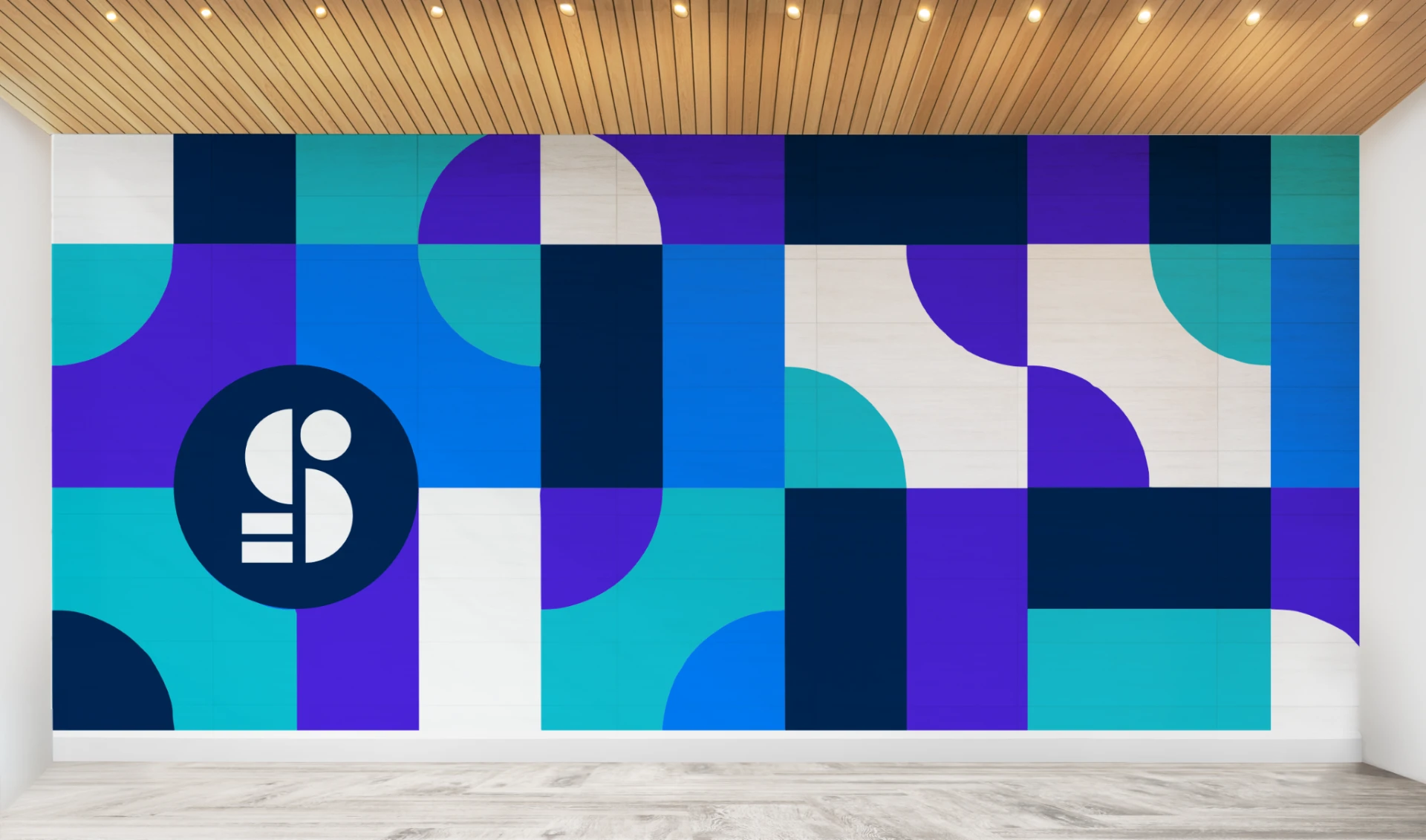 SmartSights office wall mural with a circular logo mark and a grid of navy, blue, violet, teal and white rectangles and quarter circles beneath a wood slat ceiling, above a pale wood floor